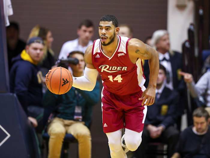 Rider Broncs guard Dimencio Vaughn (14) dribbles the ball up the floor during the first half against the West Virginia Mountaineers at WVU Coliseum. Mandatory Credit: Ben Queen-USA TODAY Sports